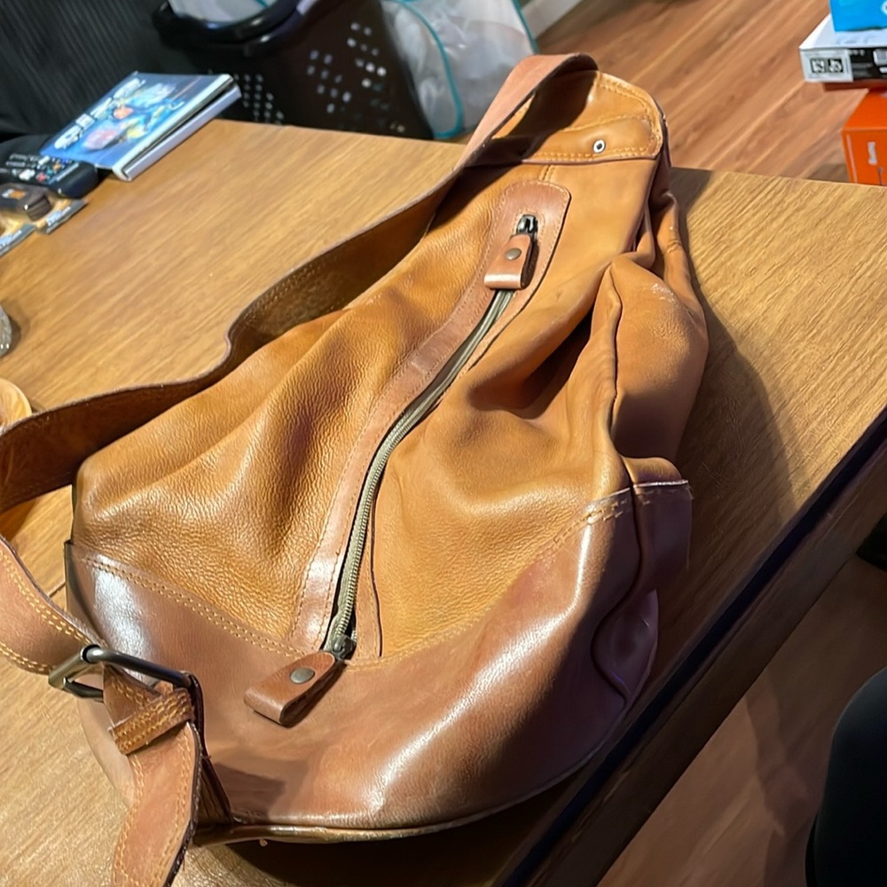 Tan leather sling bag made in Thailand